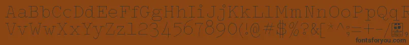 Шрифт TypowriterThinDemo – чёрные шрифты на коричневом фоне