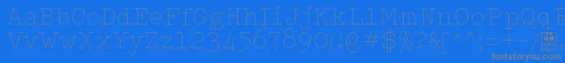 フォントTypowriterThinDemo – 青い背景に灰色の文字