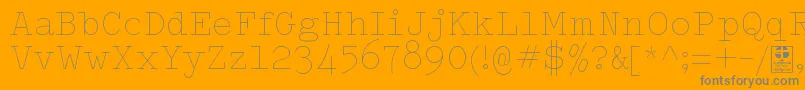 TypowriterThinDemo-Schriftart – Graue Schriften auf orangefarbenem Hintergrund