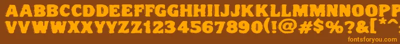 フォントVtcnightofthedrippydeadfatcaps – オレンジ色の文字が茶色の背景にあります。