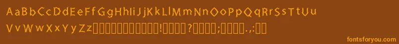 フォントZinedkaRegular – オレンジ色の文字が茶色の背景にあります。