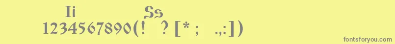 フォントIzhitsaos – 黄色の背景に灰色の文字