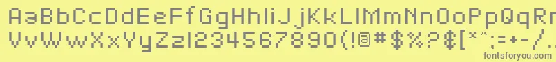 フォントSfPixelate – 黄色の背景に灰色の文字