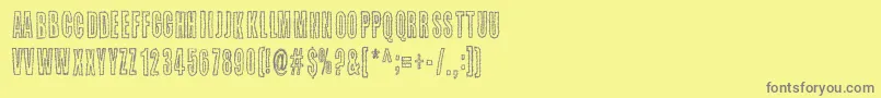 フォントKaktuspiste – 黄色の背景に灰色の文字