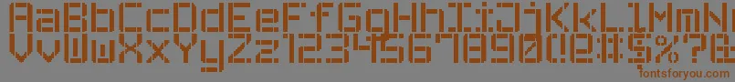 フォントStencilPixel7 – 茶色の文字が灰色の背景にあります。