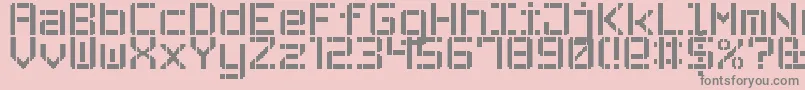 フォントStencilPixel7 – ピンクの背景に灰色の文字