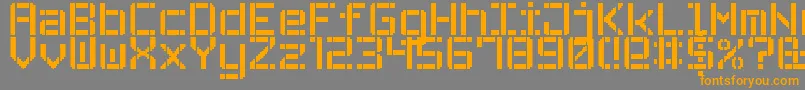 フォントStencilPixel7 – オレンジの文字は灰色の背景にあります。