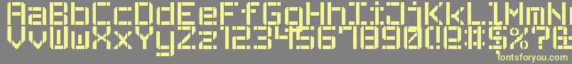 Czcionka StencilPixel7 – żółte czcionki na szarym tle