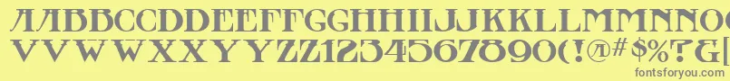 フォントStowawayMf – 黄色の背景に灰色の文字