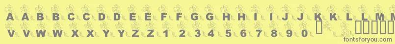Fonte LmsPartOfTheFontWorld – fontes cinzas em um fundo amarelo