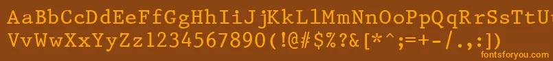 フォントPrest37 – オレンジ色の文字が茶色の背景にあります。