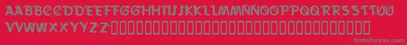 フォントKrCaneLetters – 赤い背景に灰色の文字