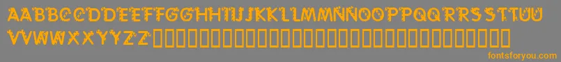 フォントKrCaneLetters – オレンジの文字は灰色の背景にあります。