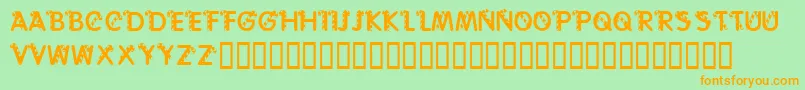 フォントKrCaneLetters – オレンジの文字が緑の背景にあります。