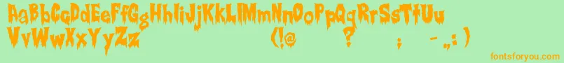 Creepsville-Schriftart – Orangefarbene Schriften auf grünem Hintergrund