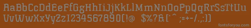 Korneuburg-fontti – harmaat kirjasimet ruskealla taustalla