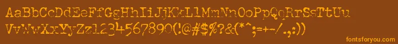 Шрифт PfdumboldtypewriterOneLight – оранжевые шрифты на коричневом фоне