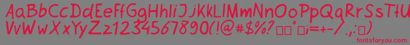 フォントNetsrak – 赤い文字の灰色の背景