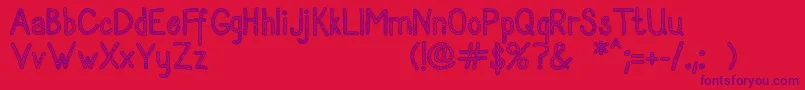 Sanzenpersonaluse Font – Purple Fonts on Red Background