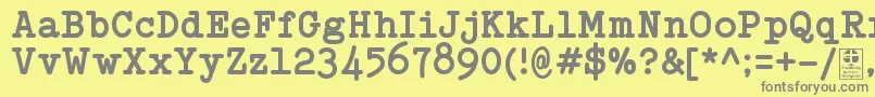 Fonte TypowriterBoldDemo – fontes cinzas em um fundo amarelo