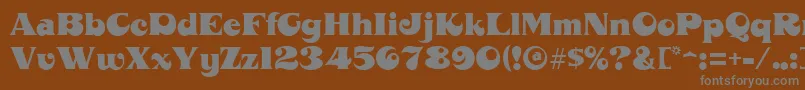 MahoneyRegular-fontti – harmaat kirjasimet ruskealla taustalla
