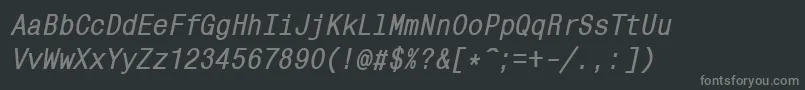 Mnc58C-fontti – harmaat kirjasimet mustalla taustalla