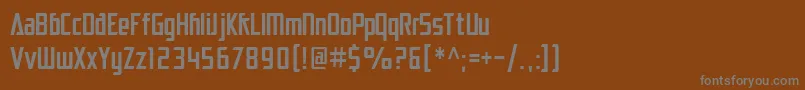 SfElectrotomeCondensed-fontti – harmaat kirjasimet ruskealla taustalla
