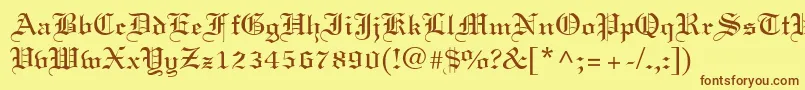 フォントLinotext – 茶色の文字が黄色の背景にあります。