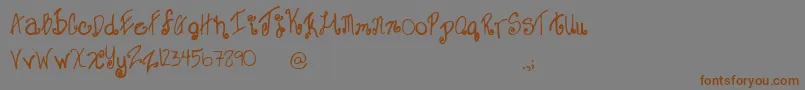 SweetJanet-Schriftart – Braune Schriften auf grauem Hintergrund