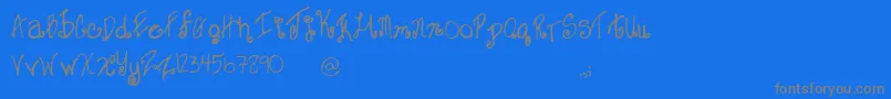 SweetJanet-Schriftart – Graue Schriften auf blauem Hintergrund