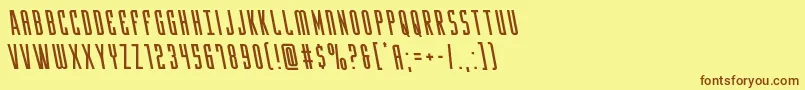 フォントYfilesleft – 茶色の文字が黄色の背景にあります。