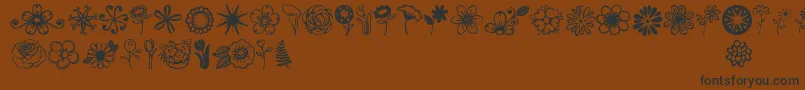 Czcionka Jandaflowerdoodles – czarne czcionki na brązowym tle