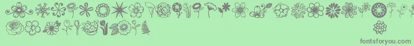 Jandaflowerdoodles-Schriftart – Graue Schriften auf grünem Hintergrund