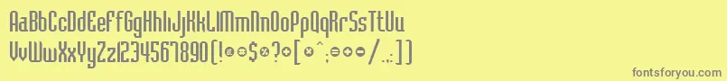 BelushiRegularDb-Schriftart – Graue Schriften auf gelbem Hintergrund
