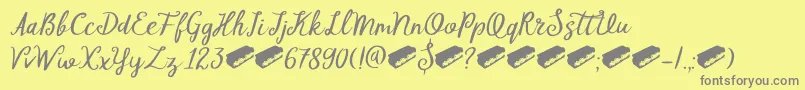 Fonte DkTompouce – fontes cinzas em um fundo amarelo