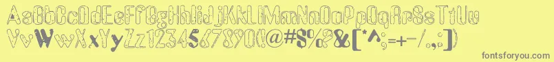 OldMessy-fontti – harmaat kirjasimet keltaisella taustalla
