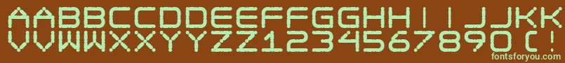 フォントEgotripF – 緑色の文字が茶色の背景にあります。