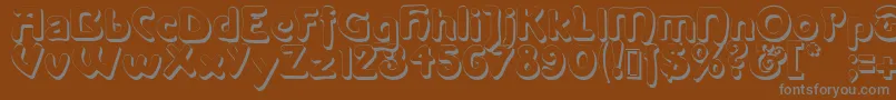 Lanegritashadow-fontti – harmaat kirjasimet ruskealla taustalla