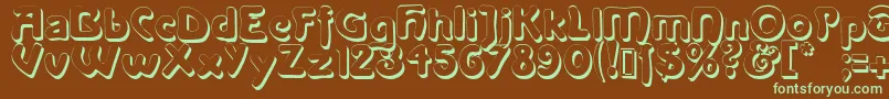 Lanegritashadow-fontti – vihreät fontit ruskealla taustalla
