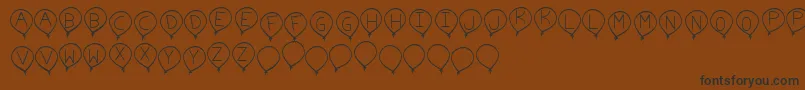 BirthdayBalonTfb Font – Black Fonts on Brown Background