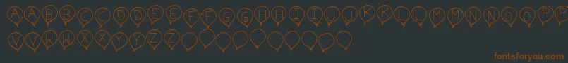 BirthdayBalonTfb-Schriftart – Braune Schriften auf schwarzem Hintergrund