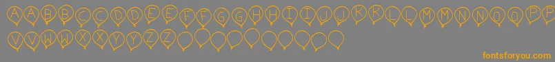 BirthdayBalonTfb-Schriftart – Orangefarbene Schriften auf grauem Hintergrund