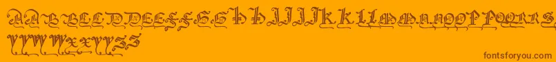 Czcionka Gothicmajuscles – brązowe czcionki na pomarańczowym tle