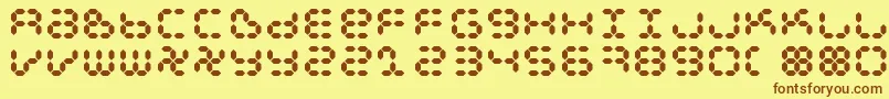 フォントDspl – 茶色の文字が黄色の背景にあります。