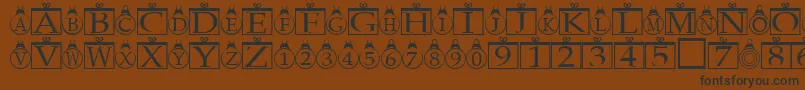 Xmasregular Font – Black Fonts on Brown Background