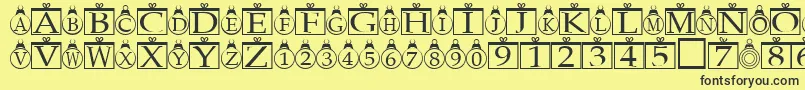 Fonte Xmasregular – fontes pretas em um fundo amarelo