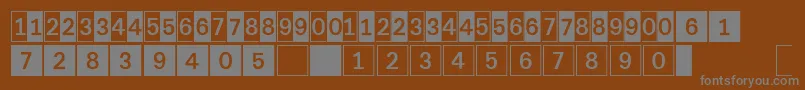 DeconumbersLhSquare-Schriftart – Graue Schriften auf braunem Hintergrund
