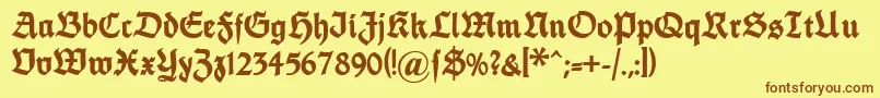 フォントDsfettethannhaeuser – 茶色の文字が黄色の背景にあります。