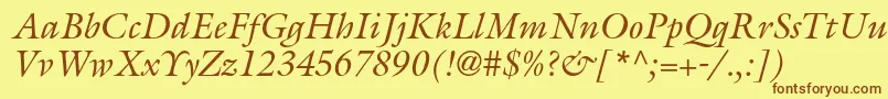 フォントGalliardstdItalic – 茶色の文字が黄色の背景にあります。