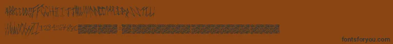 Czcionka Freakymanor – czarne czcionki na brązowym tle
